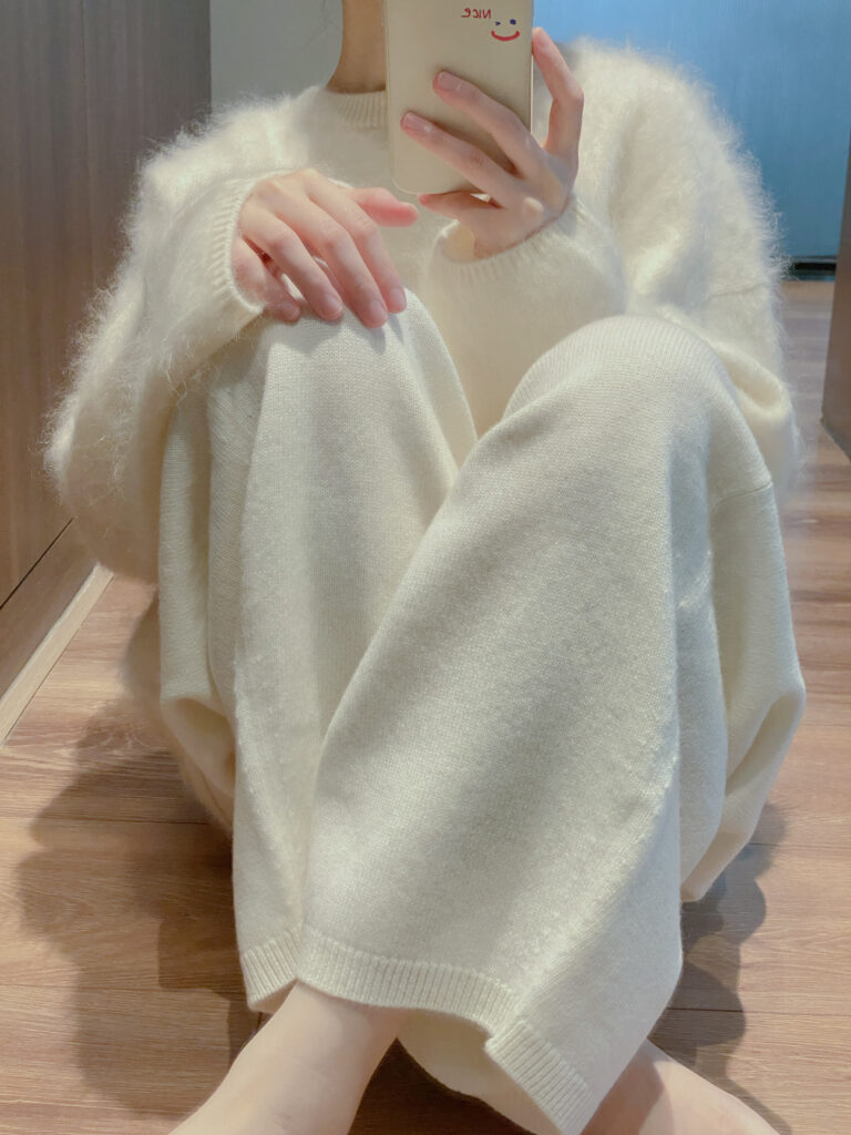 Soft brushed cashmere sweater in off-white, featuring a fuzzy, luxurious texture for premium knitwear OEM collections